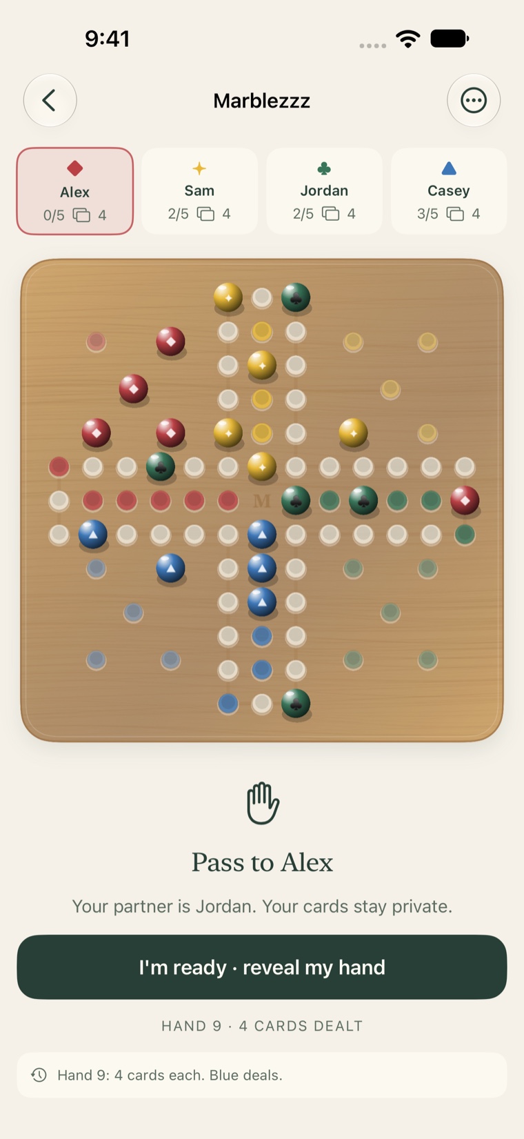 Private handoff screen asking the next player to reveal their hand.